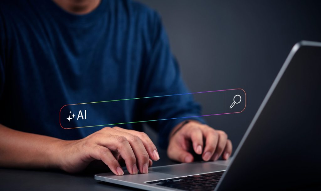 person typing on a laptop AI search bar on the screen, artificial intelligence digital assistant, smart innovation and machine learning. modern technology, data analysis, and software development.